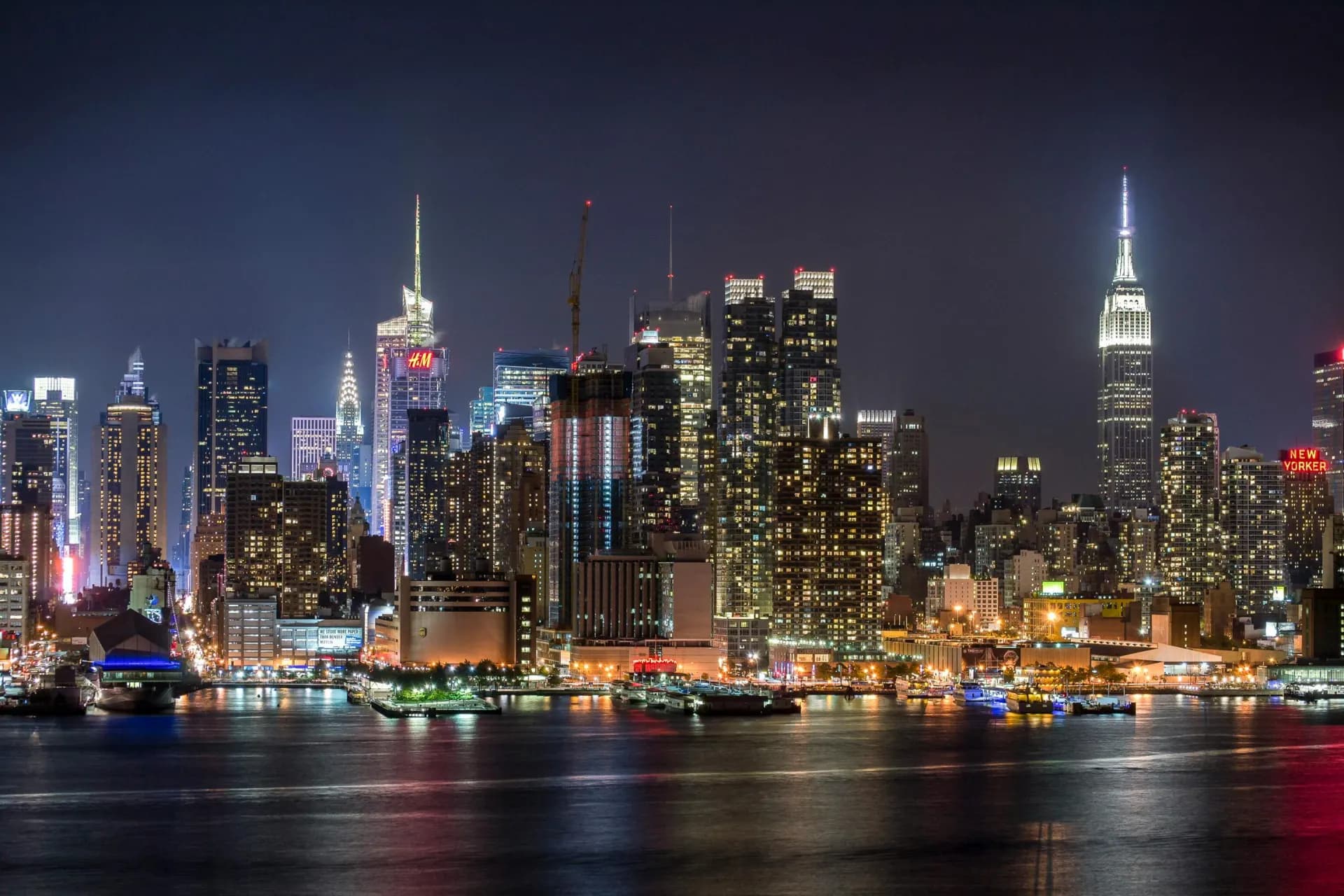 The Manhattan skyline at night with the Empire State Building illuminated